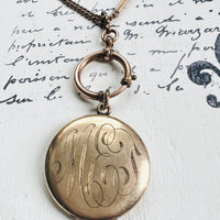 Gold Photo Locket attached to a albert watch chain