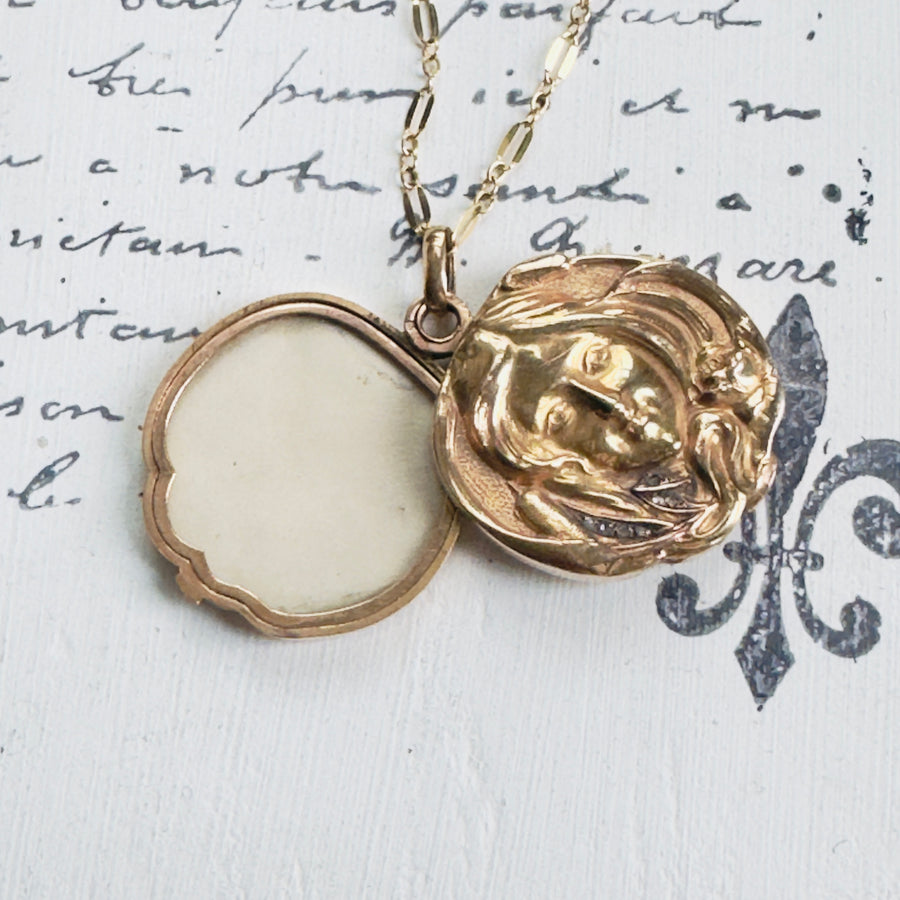 Round Antique Gold Locket with raised femaile cameo