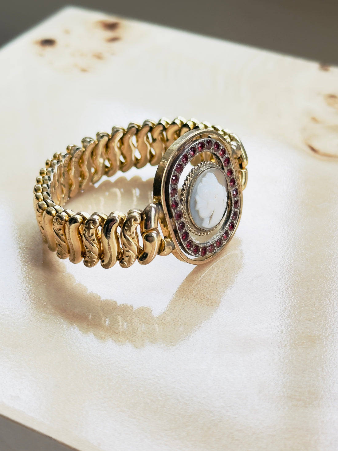 American Queen sweetheart expansion bracelet featuring carved cameo center