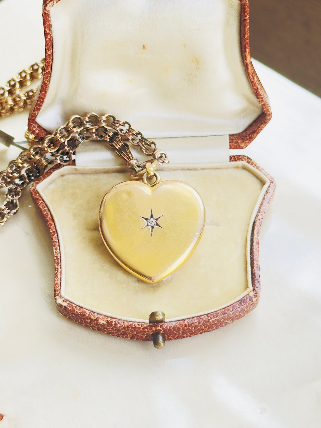 Antique 10k gold heart locket with diamond center, front detail showing vintage patina and craftsmanship, hipV Modern Vintage Jewelry