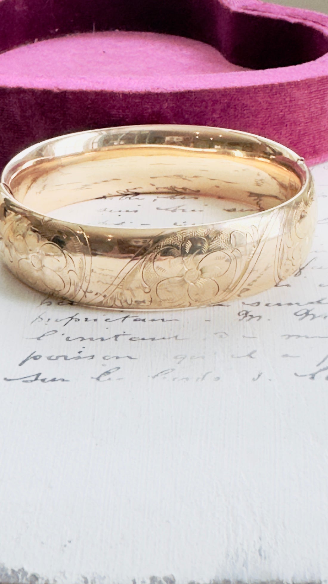 Gold bangle with floral etched details