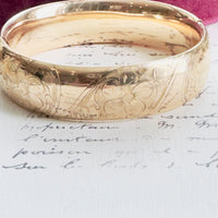 Gold bangle with floral etched details