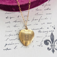 Locket displayed on 18-inch gold-filled paperclip chain