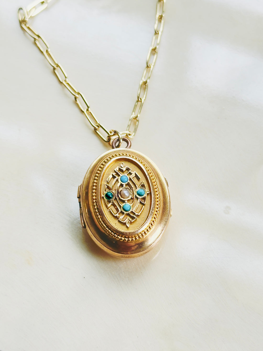 Antique gold locket necklace with floral motif and beaded border detail, hipV