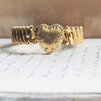 Antique gold sweetheart bracelet featuring engraved scrollwork heart with star-set diamond, ribbed expansion band, hipV Modern Vintage