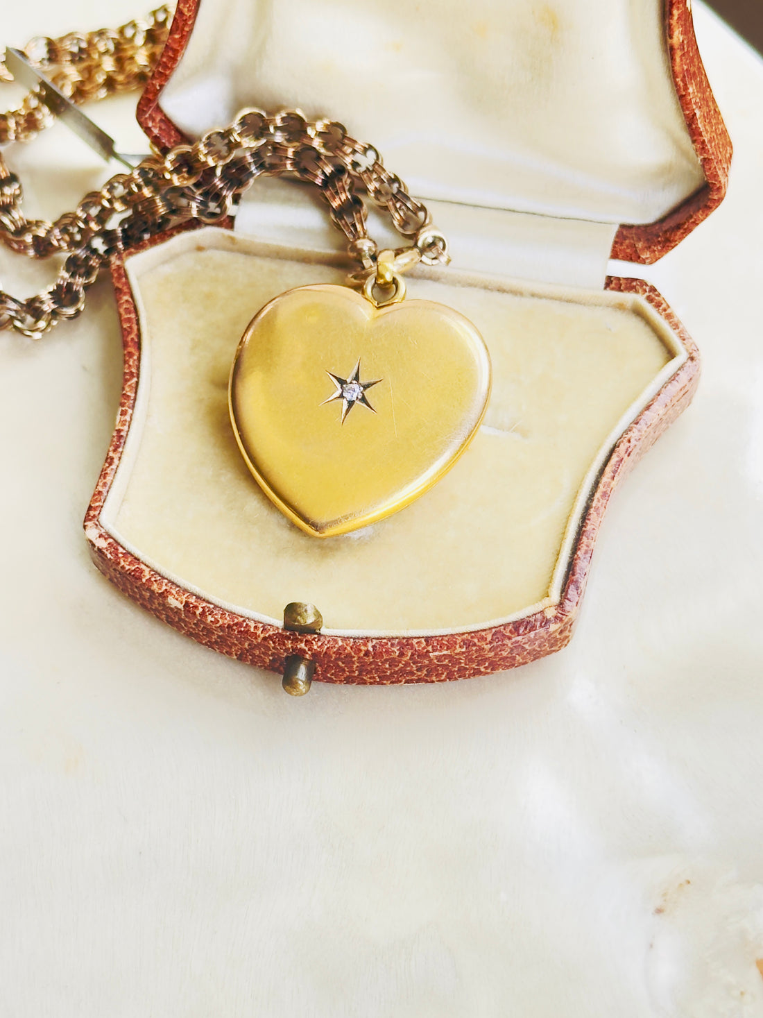 Antique heart locket in 10k yellow gold with old cut diamond center stone