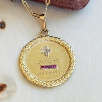 Augis love medal with laurel wreath detail suspended from gold paperclip chain