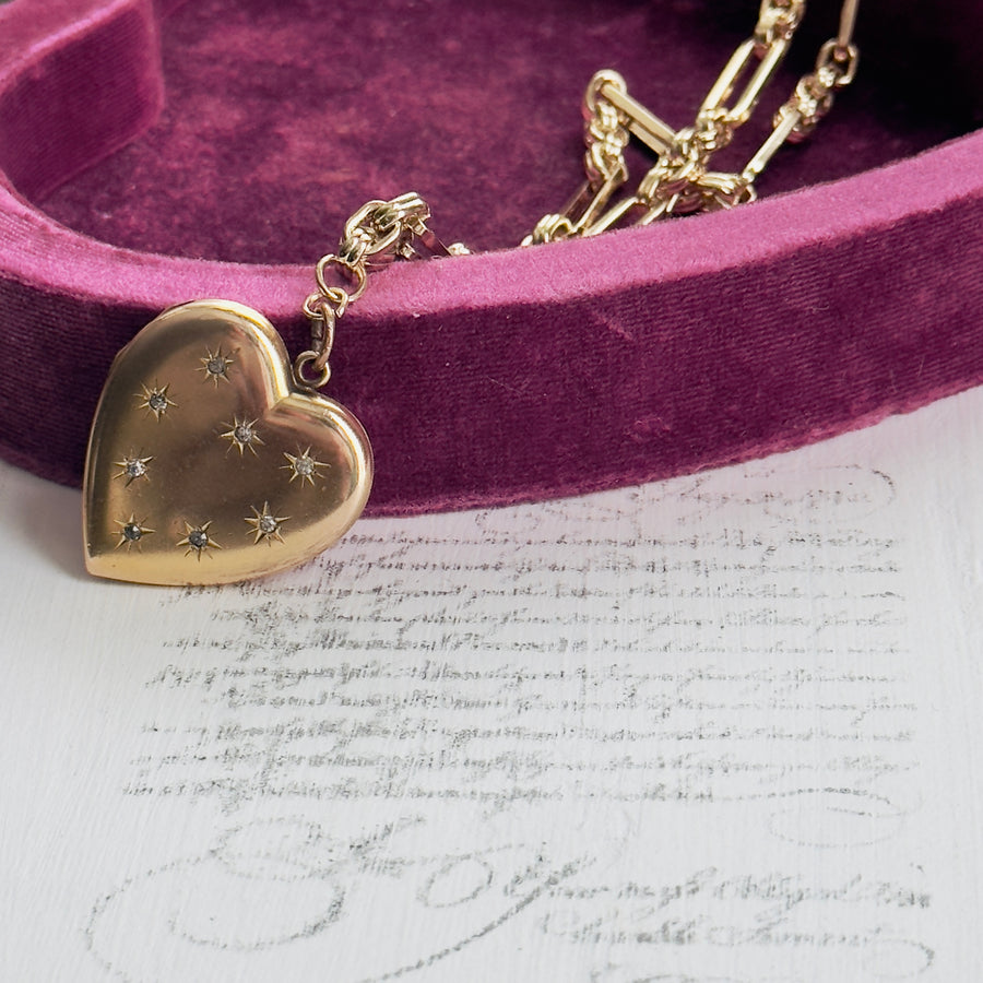 Gold-filled heart locket with starburst paste stone design on paper clip chain