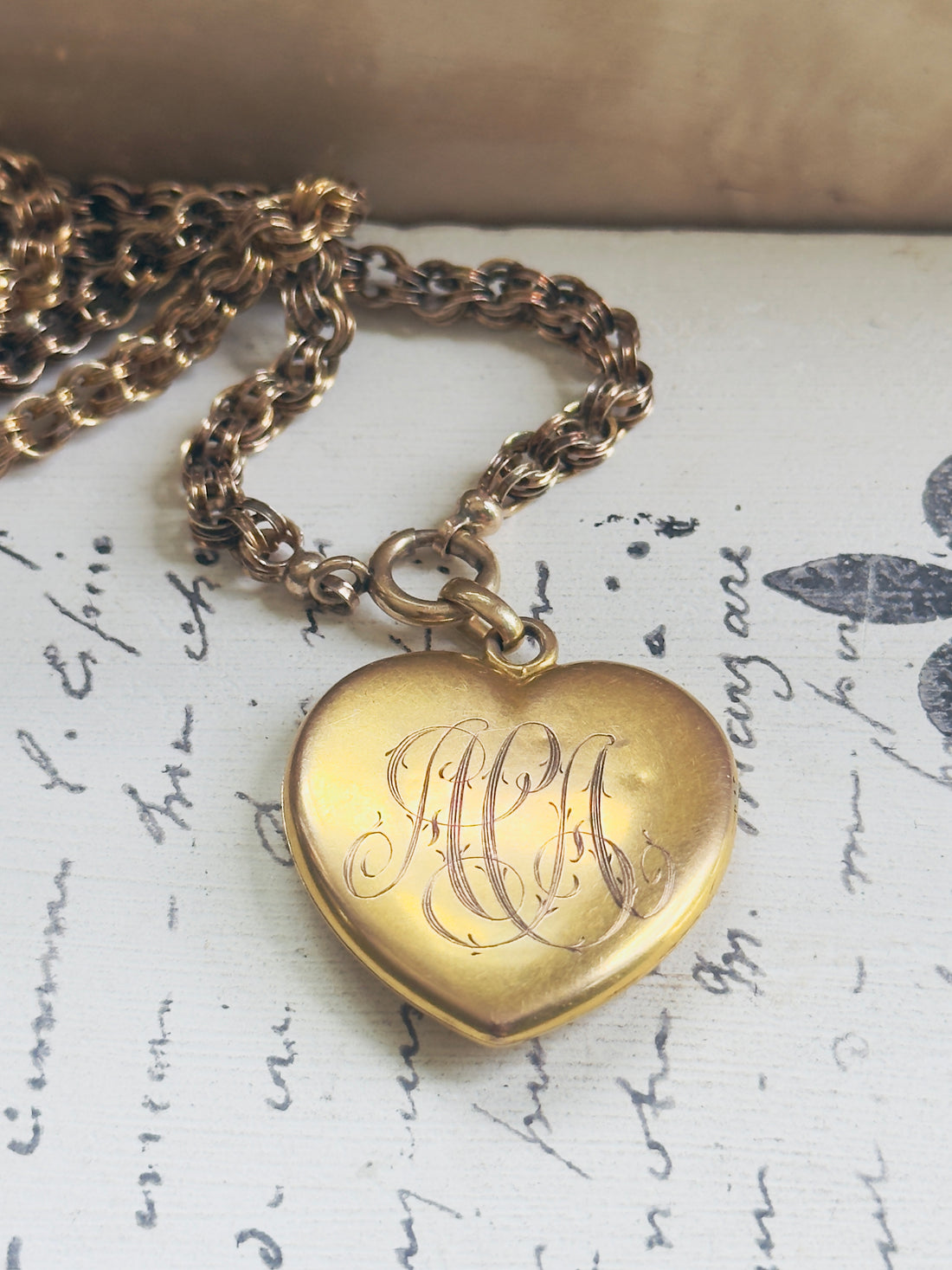 Back view of Victorian era 10k gold heart locket with original monogram engraving, hipV Modern Vintage Jewelry