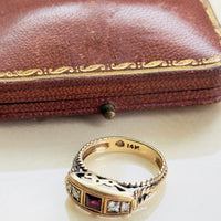 Bold statement ruby ring with crown motif and rope twist shoulders