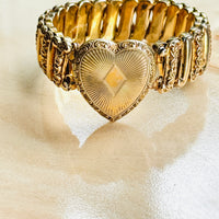 Close-up of sunburst engraved heart locket on antique Ladifair sweetheart bracelet
