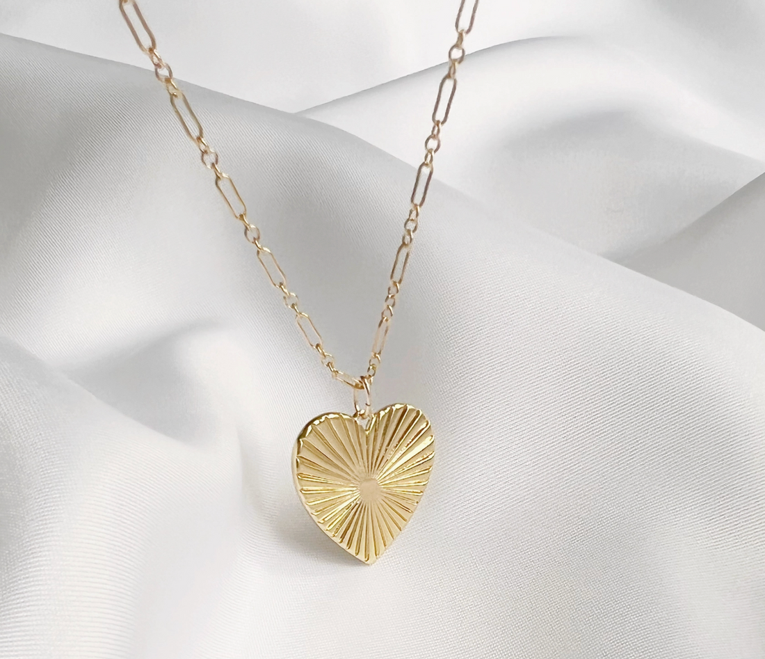 Close detail of fluted heart pendant in 14/20 certified gold filled, hipV Modern jewelry