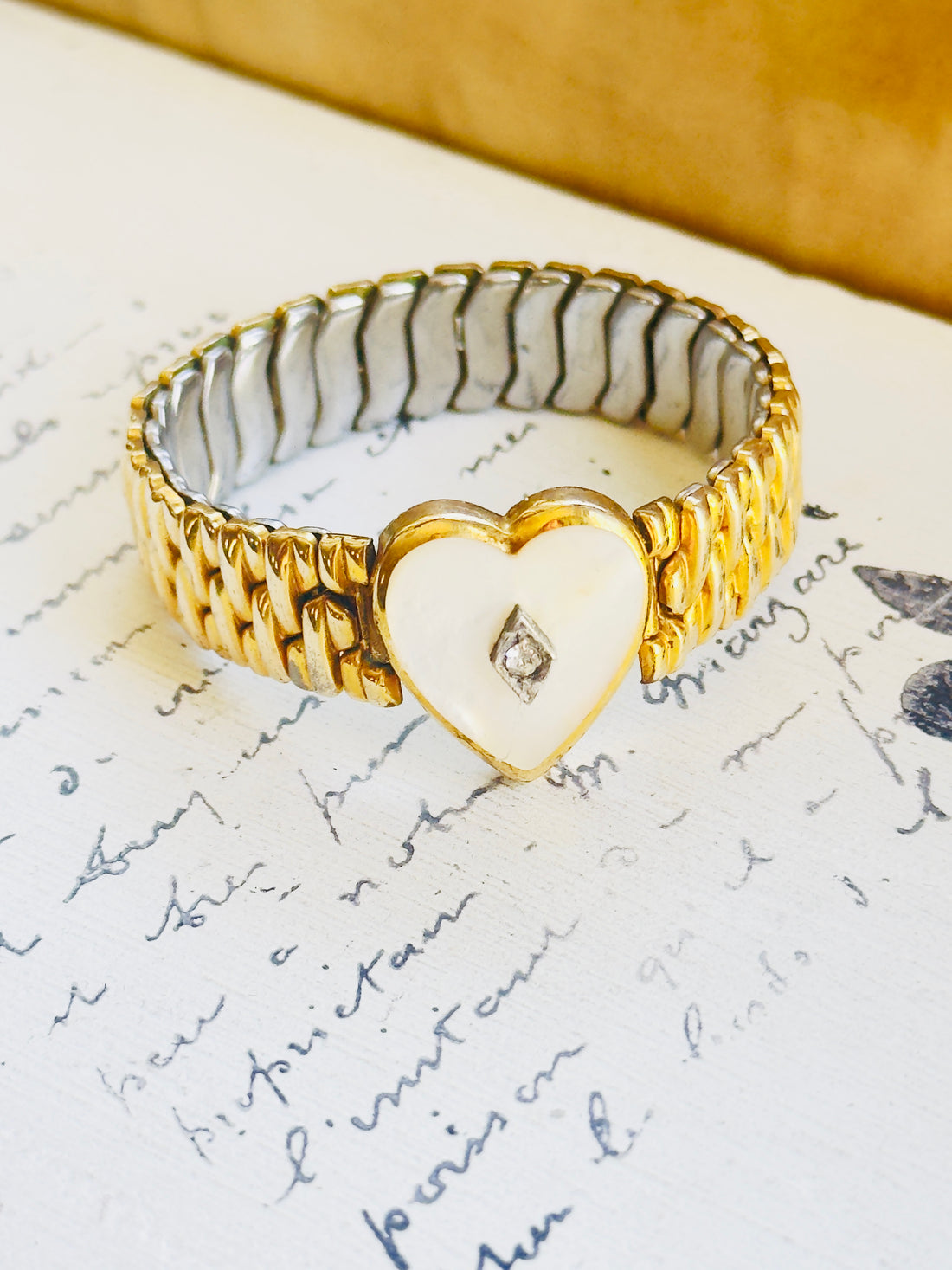 Co-Star vintage bracelet with sculptural gold links and heart center