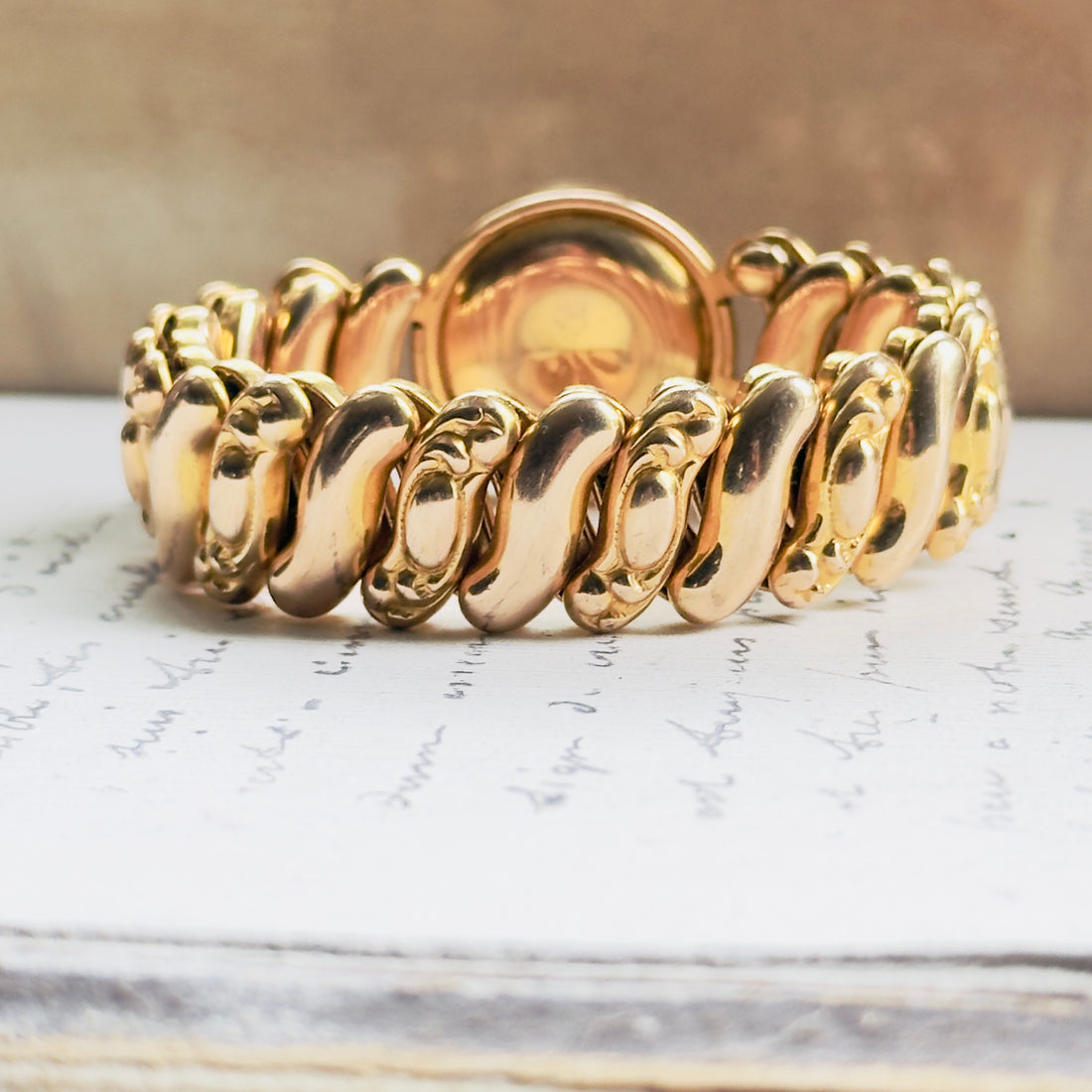Collectible unsigned mid-century sweetheart bracelet in gold filled with rhinestone halo surround and high polish finish, hipV Modern Vintage Jewelry