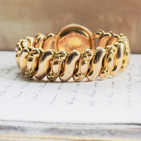 Collectible unsigned mid-century sweetheart bracelet in gold filled with rhinestone halo surround and high polish finish, hipV Modern Vintage Jewelry