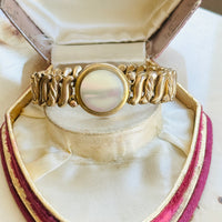 DFB Co. Carmen gold-filled sweetheart bracelet with mother of pearl center, displayed in antique jewelry box