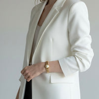 DFB Co. Carmen sweetheart bracelet worn on wrist, showing twisted link expansion band