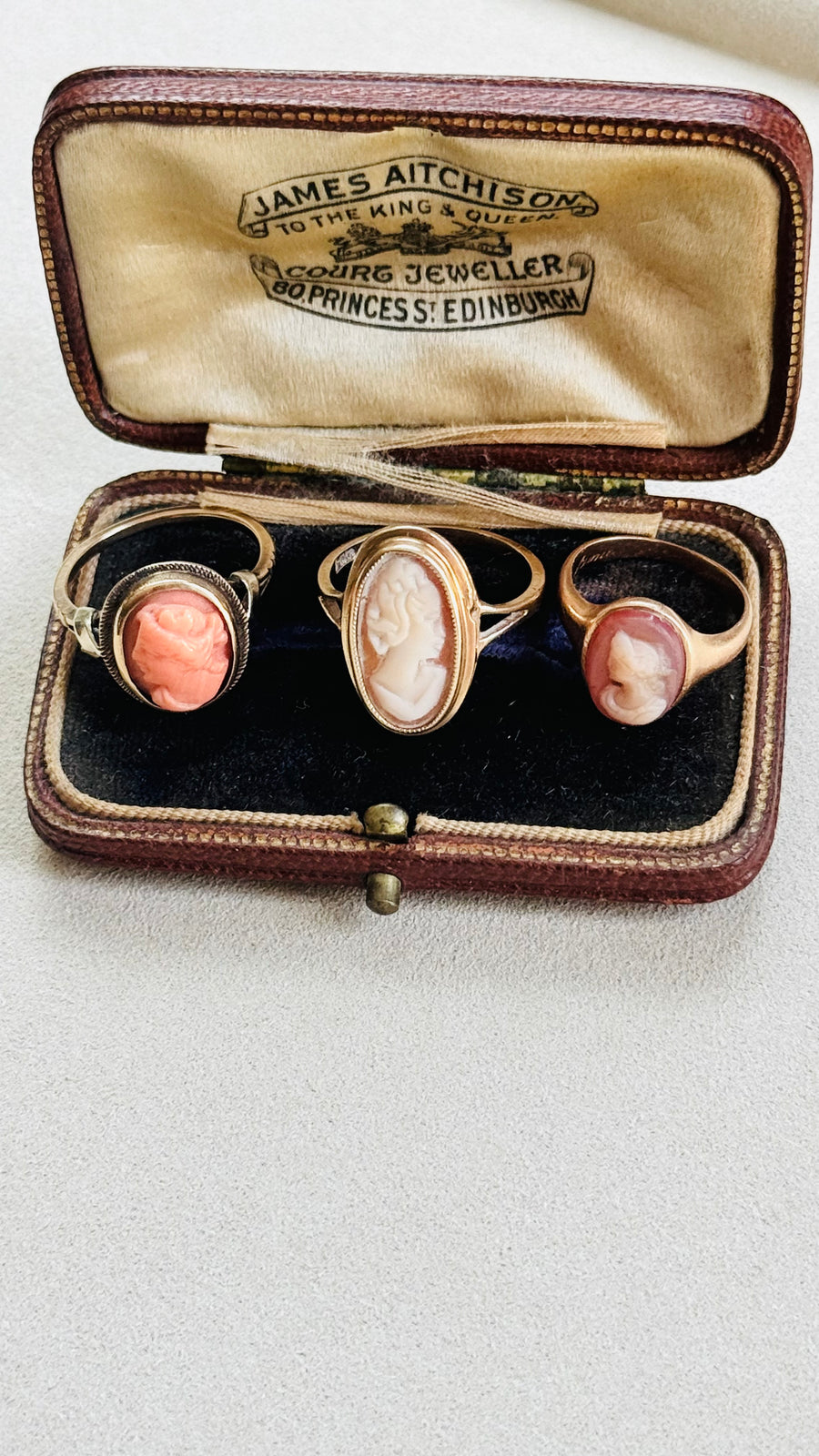 Side view showing slim split shoulders on 14k gold coral cameo ring