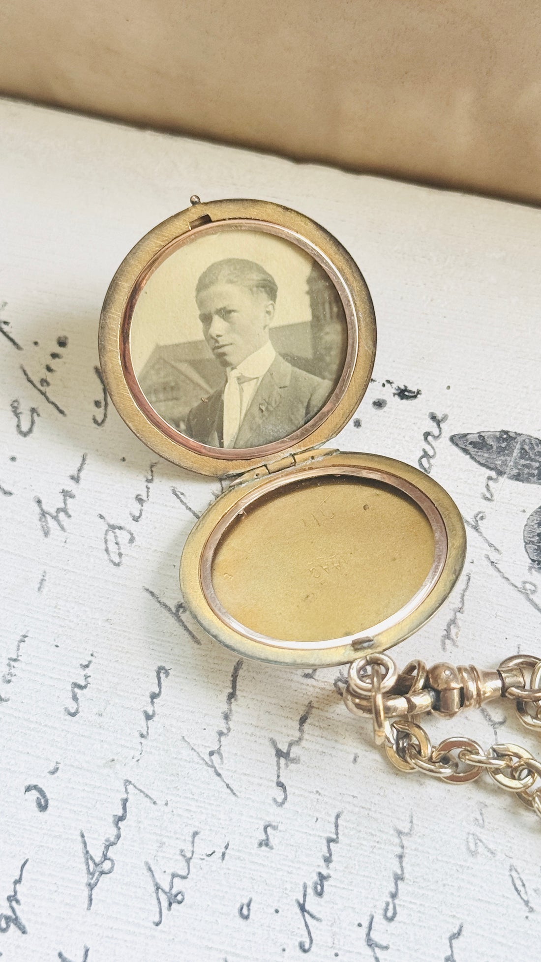 Edwardian celestial locket opened to reveal the original photograph preserved inside for more than a century.