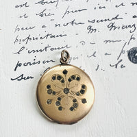 Photo Locket featuring a floral design of paste rhinestones