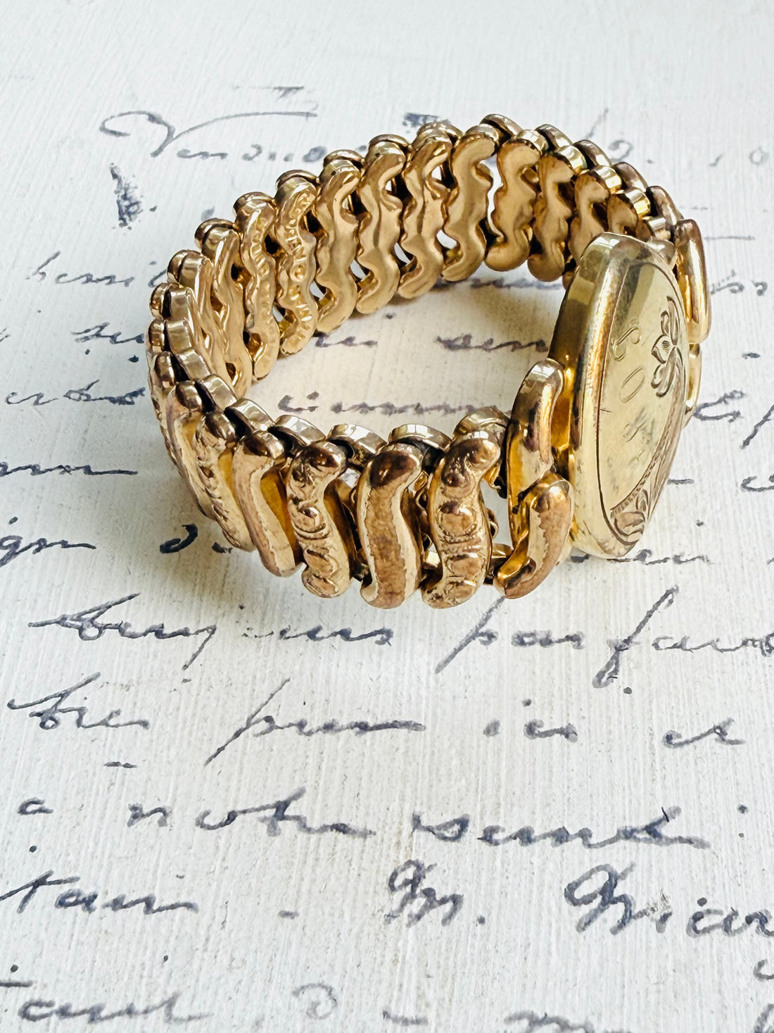 Side view of ornate expansion links on Pitman & Keeler sweetheart bracelet.