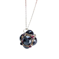 Garnet orb necklace with faceted garnets set in 14k gold