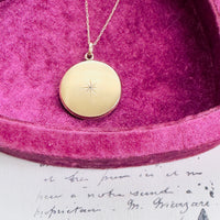 Gold-filled diamond starburst locket by W.H. & Co.