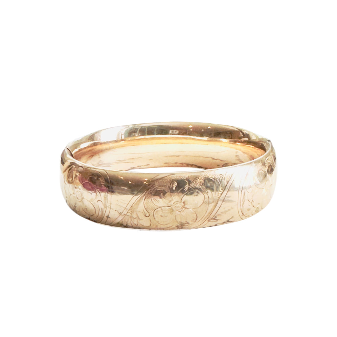 Vintage gold-filled hinged bangle bracelet with floral engraving and “ML” monogram.
