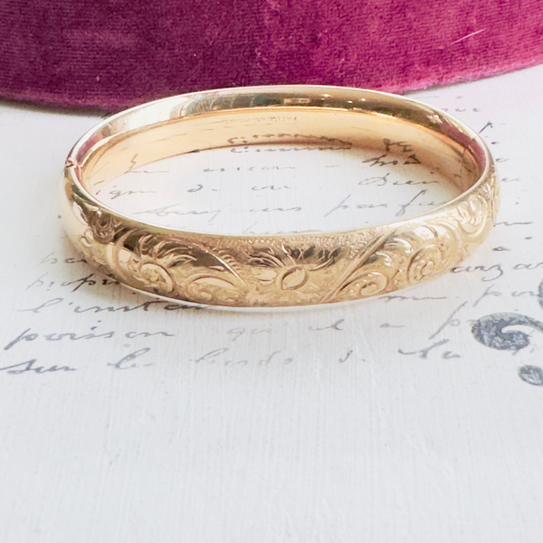Early 1900s gold-filled bangle with etched detailing.