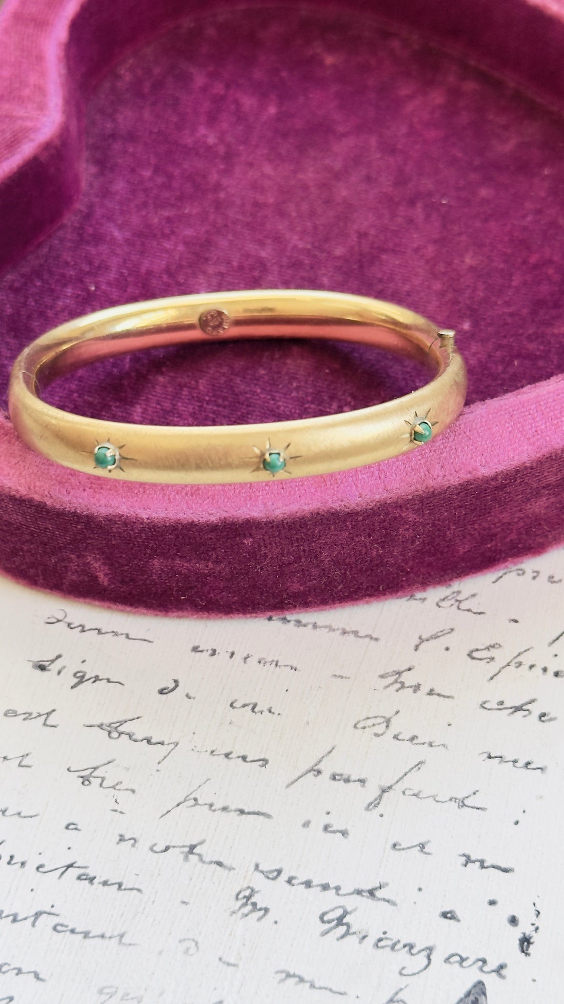 Gold filled Winard bangle showing florentine finish and etched starbursts