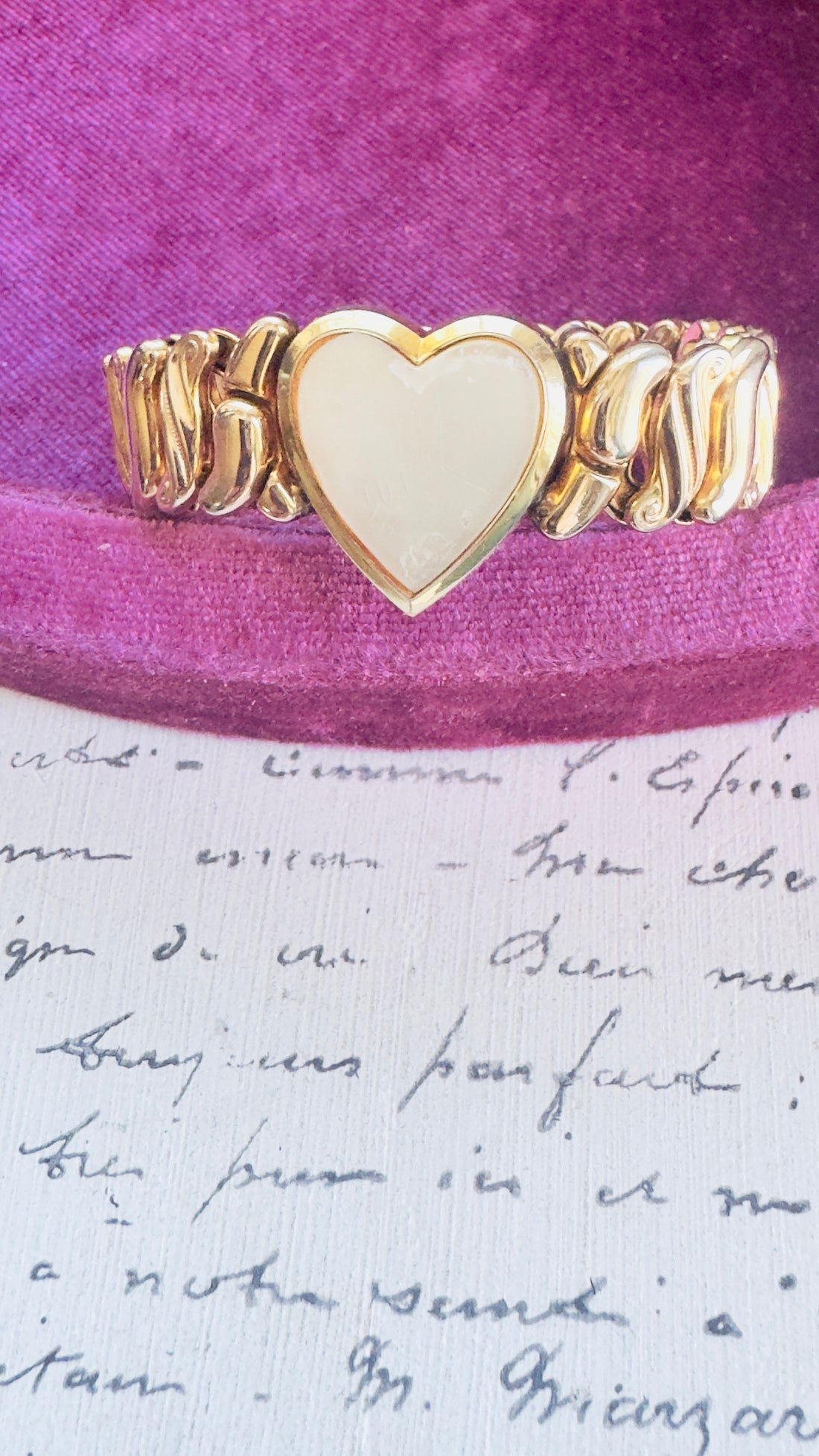 Gold filled stretch bracelet with articulated links and heart motif
