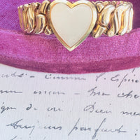 Gold filled stretch bracelet with articulated links and heart motif
