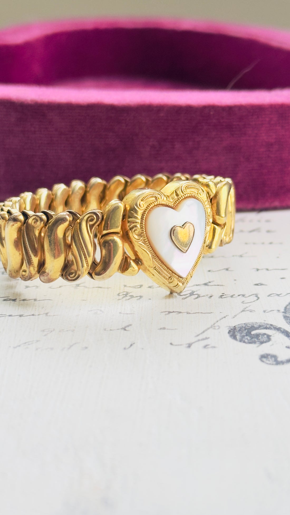 Gold filled stretch bracelet with mother of pearl heart detail
