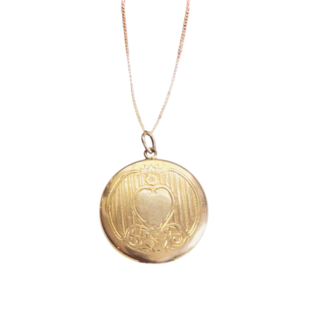 Gold-filled locket with raised heart and floral engraving on front