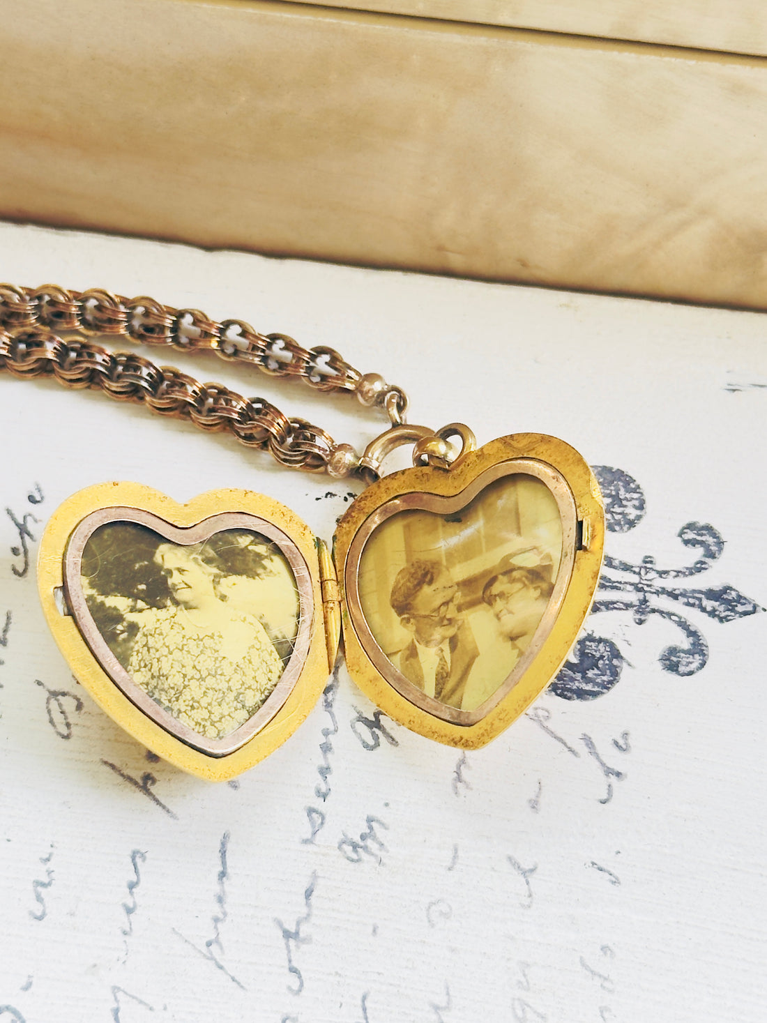 Interior of Victorian 10k gold heart locket open to show two image compartments with original photos intact, hipV Modern Vintage Jewelry
