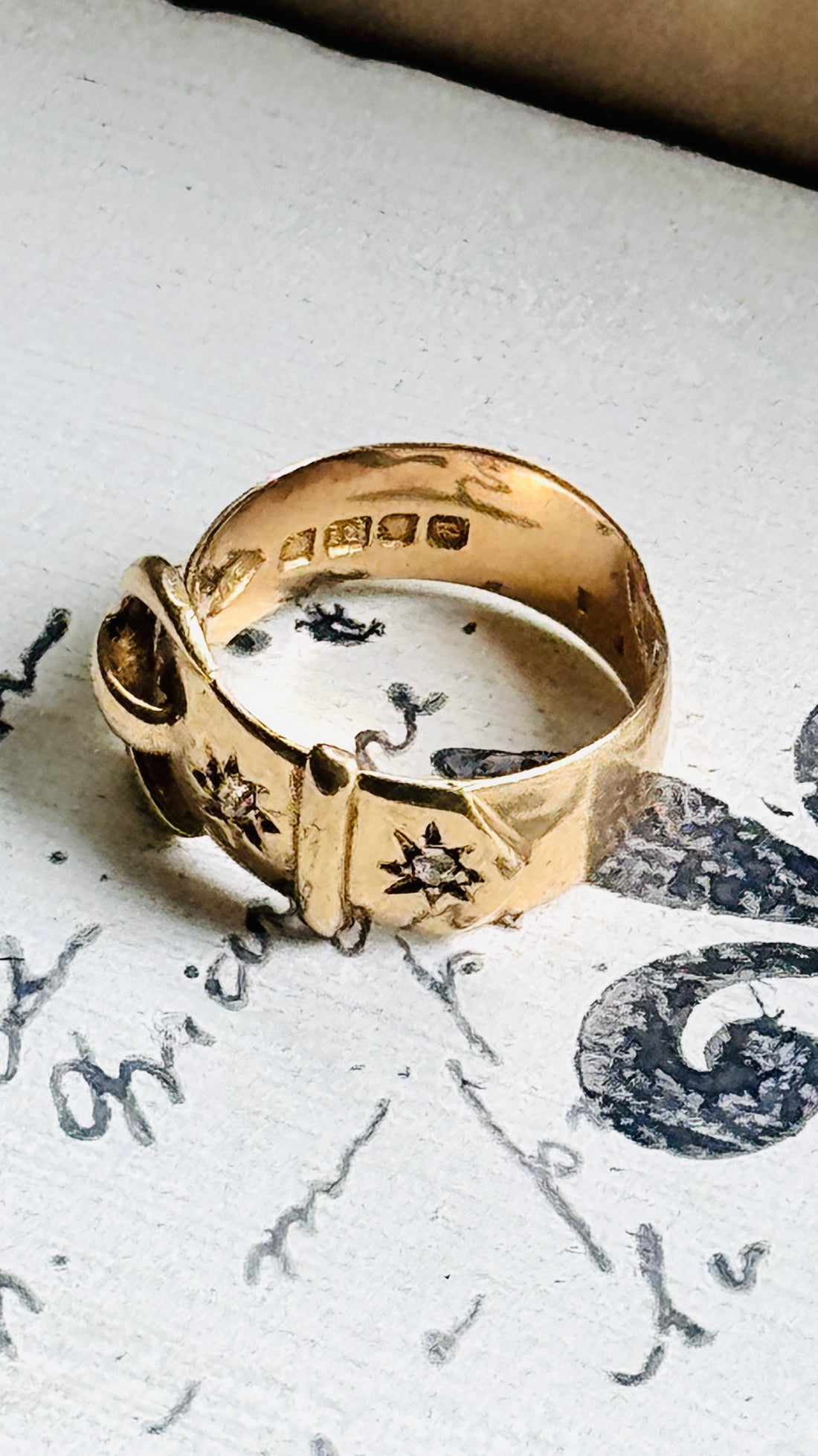 Interior view of an original 1916 English 18K gold buckle ring showing full London hallmarks and antique craftsmanship.