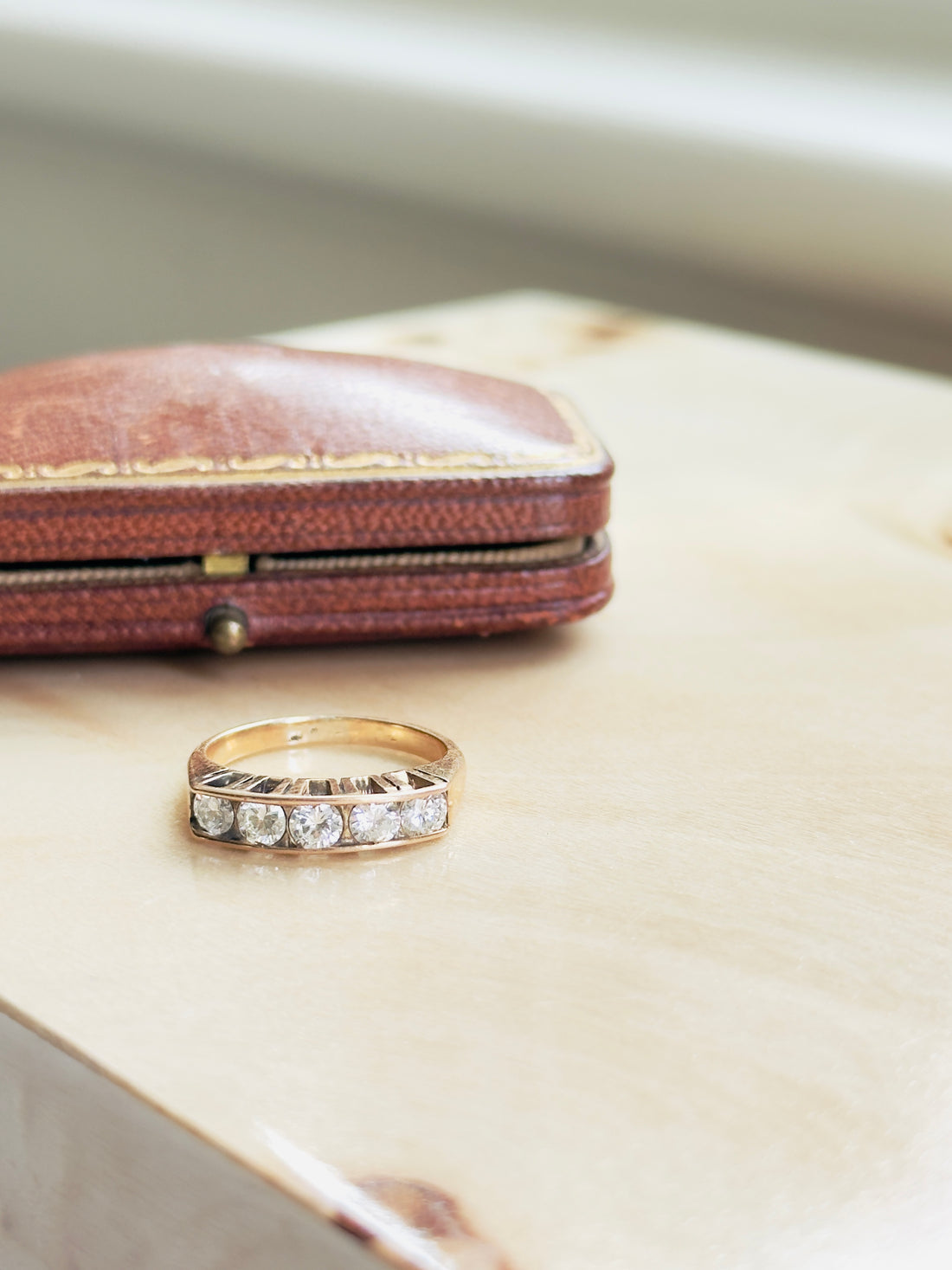 Mid-century five-diamond band with geometric shank details and 0.70 CTW stones