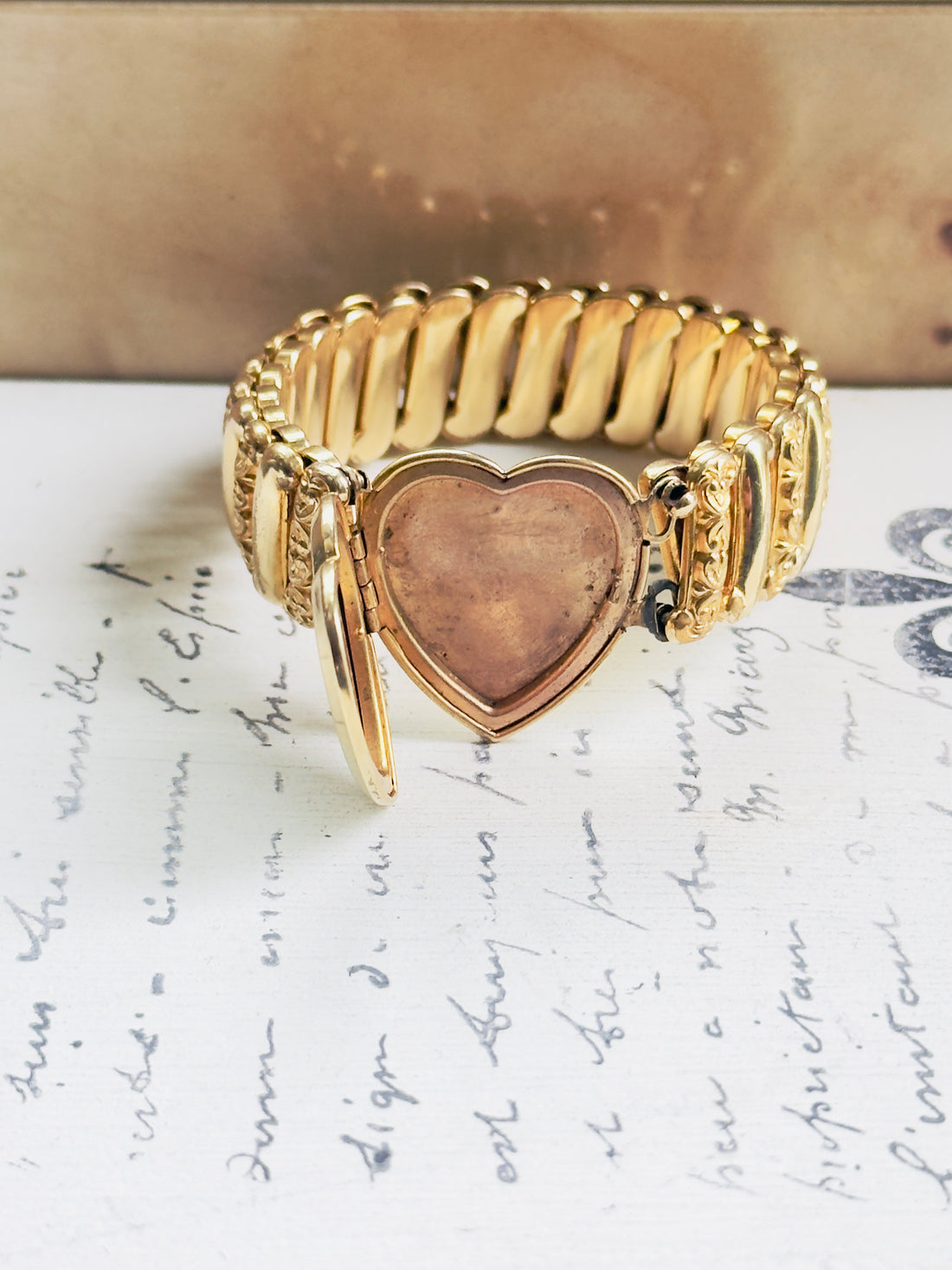 One of a kind vintage gold locket bracelet with H monogram heart center, ornate floral scroll band, estate condition, hipV