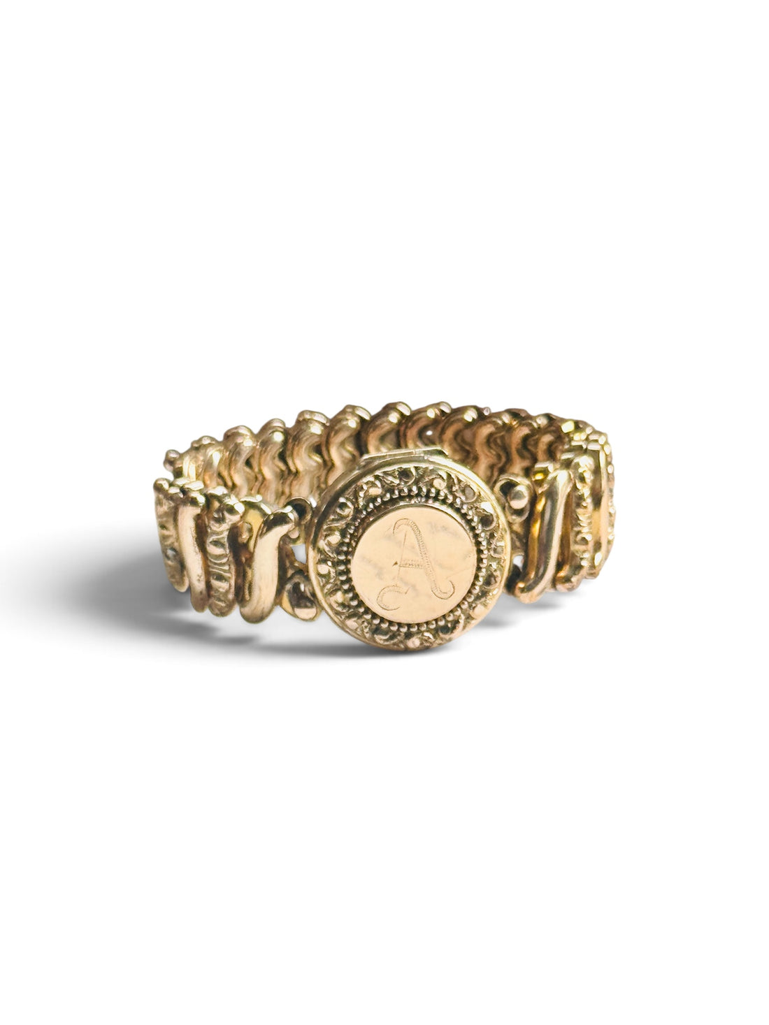 Original Carmen sweetheart expansion locket bracelet in gold-filled metal featuring an engraved A monogram.