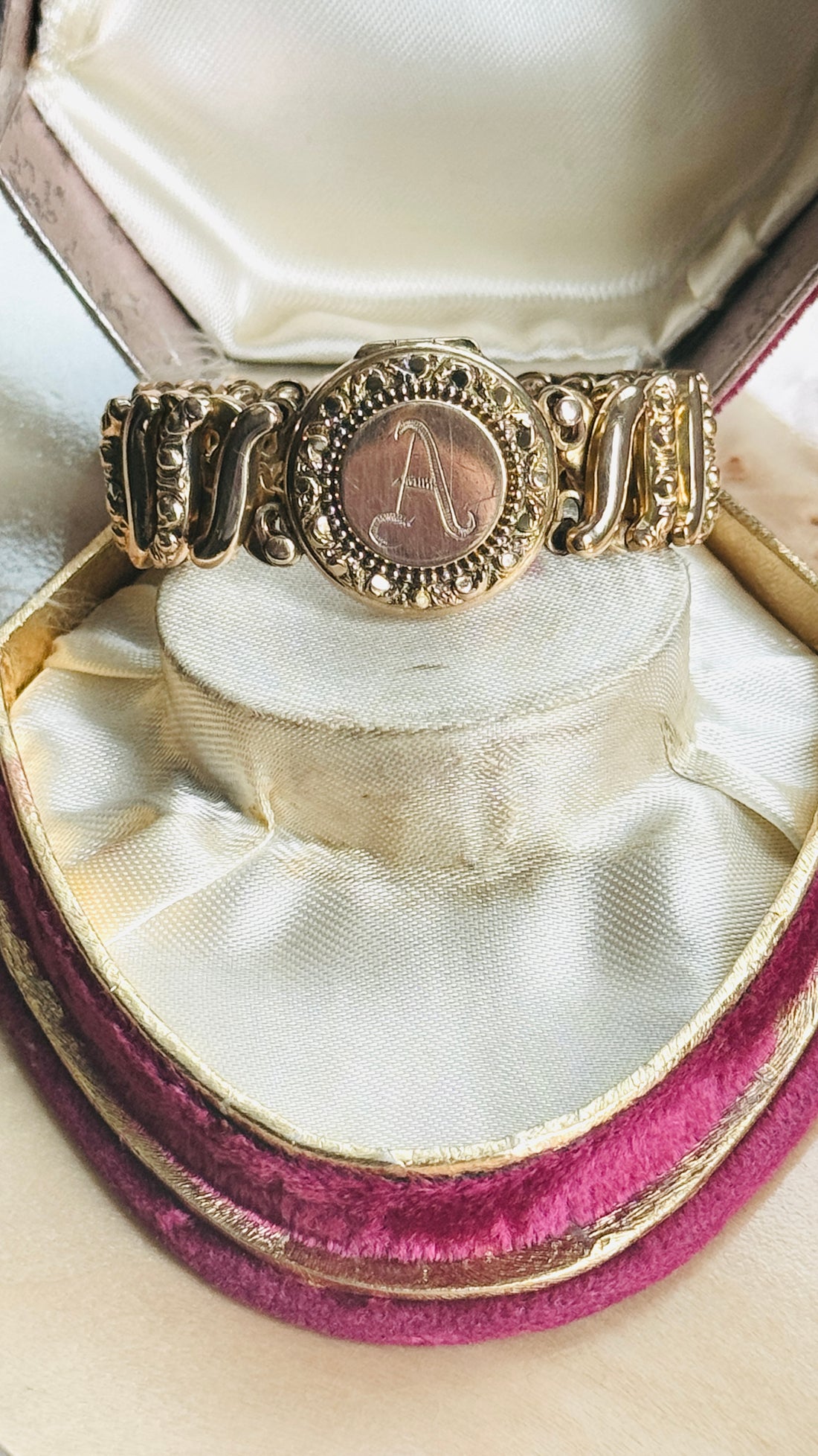 Original Carmen sweetheart expansion locket bracelet styled on a vintage  box, highlighting the engraved A monogram.
