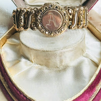 Original Carmen sweetheart expansion locket bracelet styled on a vintage  box, highlighting the engraved A monogram.