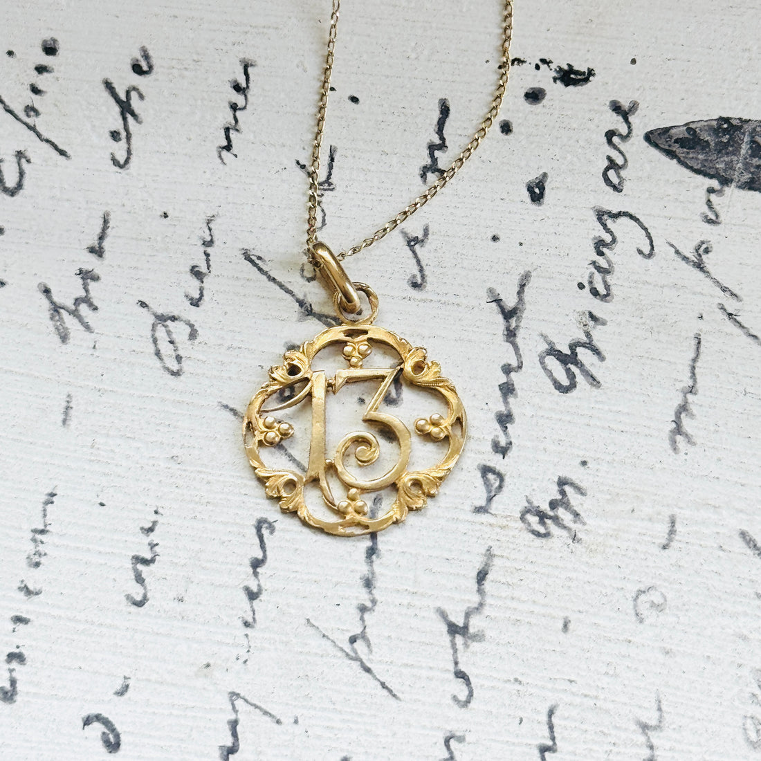 Original French Lucky Number 13 charm pendant paired with an 18-inch 14k gold chain, thoughtfully selected for modern wear.