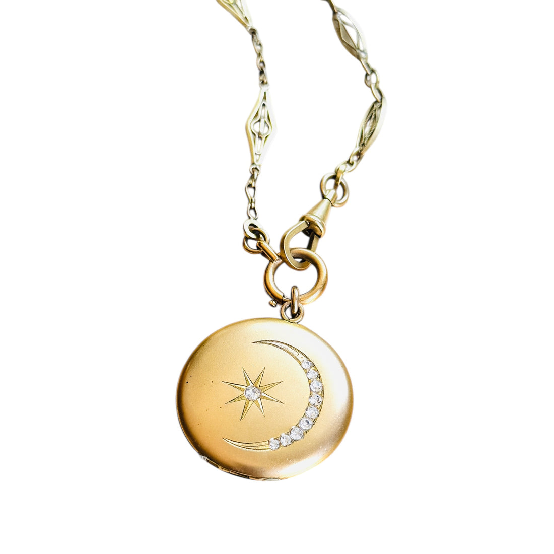Original Victorian gold-filled crescent moon locket with original paste stones on antique French ORIA watch chain, front view.
