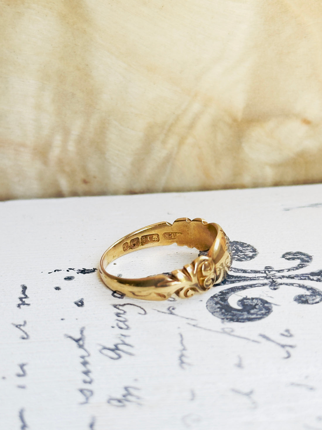 Overhead view of c.1897 Birmingham hallmarked 18k gold diamond flower ring, substantial domed band
