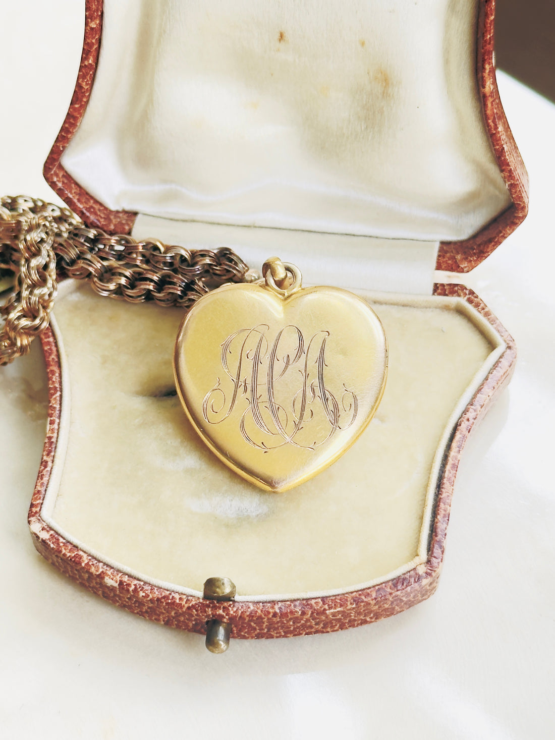 Reverse of 10k gold Victorian heart locket showing original monogram engraving, antique gold locket back detail, hipV Modern Vintage Jewelry
