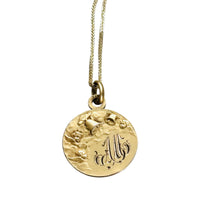 Reverse of antique FIX cherub medal showing the original engraved monogram.