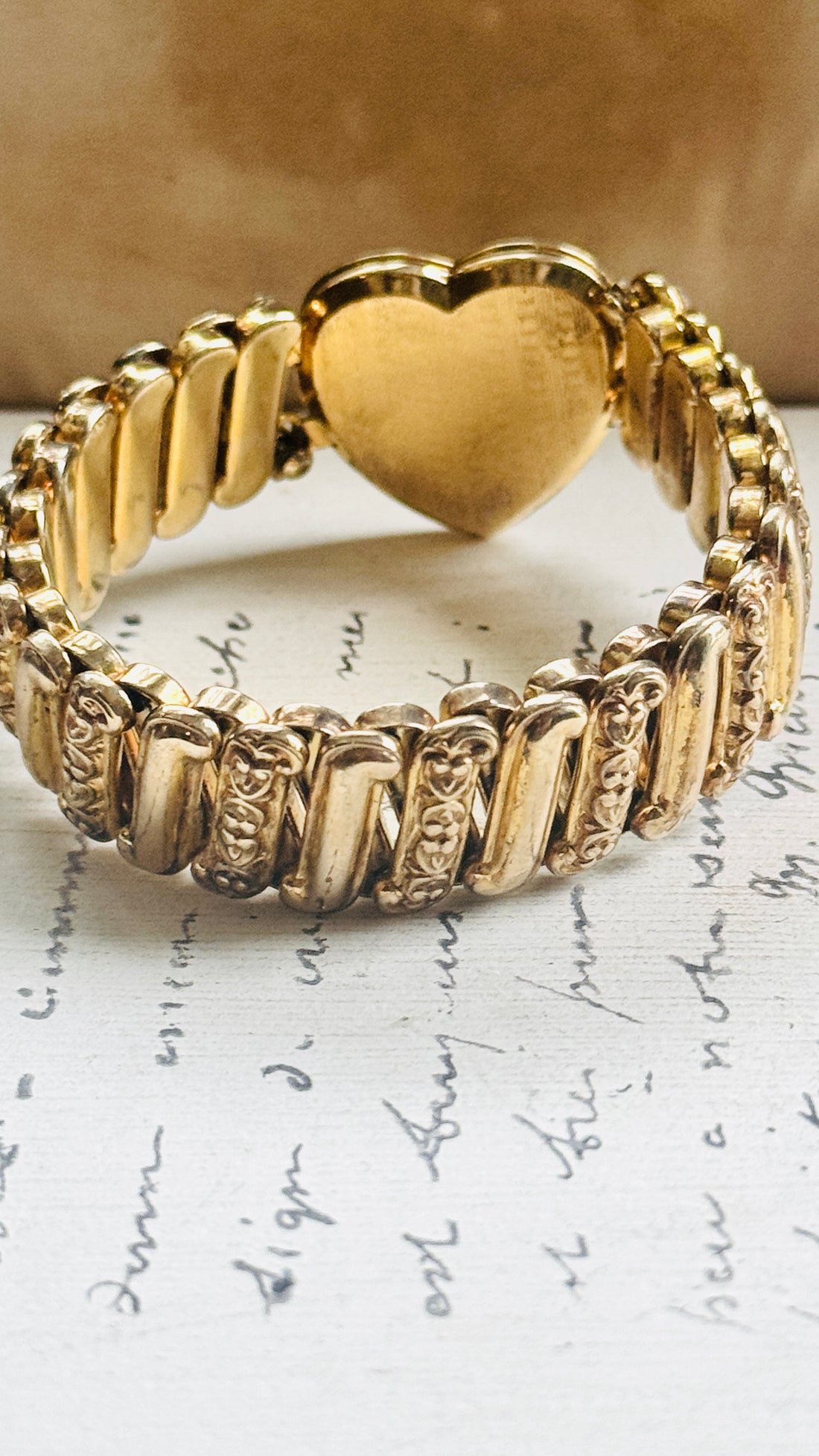 Side view of vintage sweetheart expansion bracelet showing ribbed gold filled band