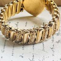 Side view of vintage sweetheart expansion bracelet showing ribbed gold filled band