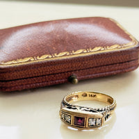 Square-cut ruby ring with four diamonds in architectural yellow gold setting