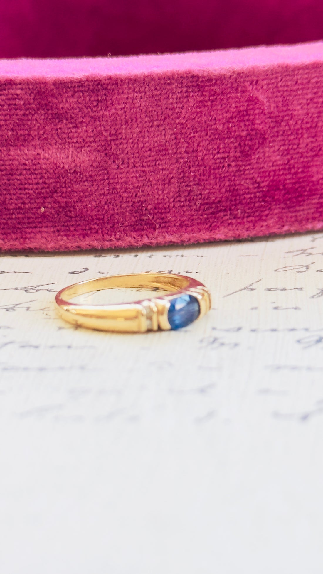 Timeless blue sapphire ring with tapered band and vintage gold setting
